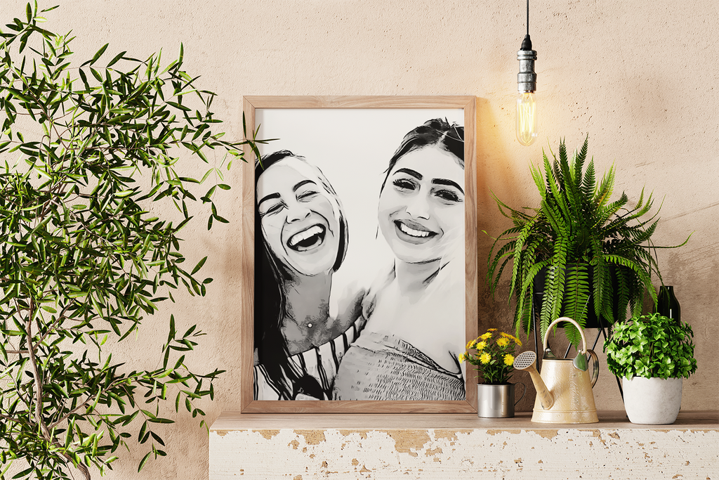 a picture of two women hanging on a wall next to a potted plant